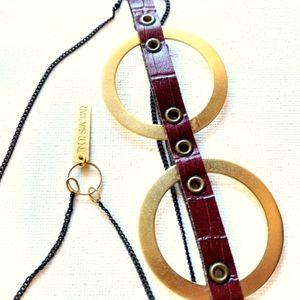 Gold tone and leather modern necklace.